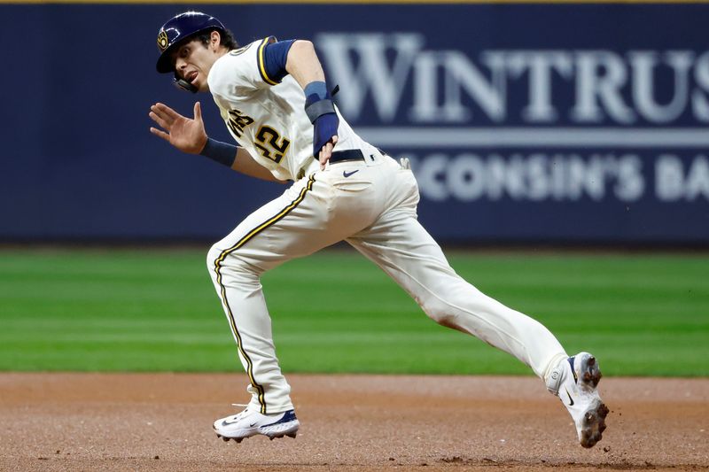 Oct 4, 2023; Milwaukee, Wisconsin, USA; Milwaukee Brewers left fielder Christian Yelich (22) steals second base against the Arizona Diamondbacks in the first inning during game two of the Wildcard series for the 2023 MLB playoffs at American Family Field. Mandatory Credit: Kamil Krzaczynski-USA TODAY Sports