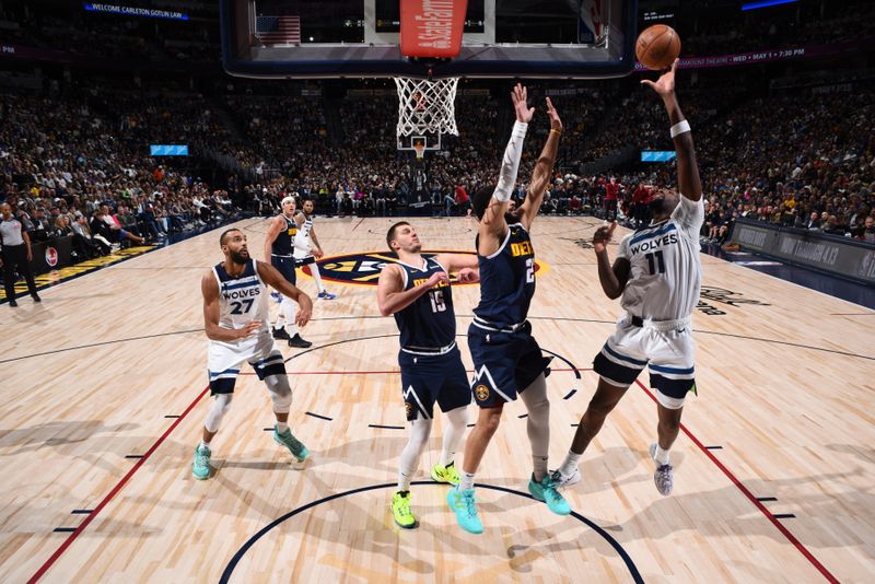 DENVER, CO - APRIL 10: Naz Reid #11 of the Minnesota Timberwolves drives to the basket during the game against the Denver Nuggets on April 10, 2024 at the Ball Arena in Denver, Colorado. NOTE TO USER: User expressly acknowledges and agrees that, by downloading and/or using this Photograph, user is consenting to the terms and conditions of the Getty Images License Agreement. Mandatory Copyright Notice: Copyright 2024 NBAE (Photo by Garrett Ellwood/NBAE via Getty Images)