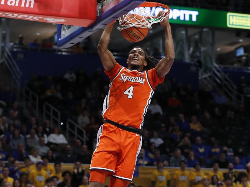 Jan 16, 2024; Pittsburgh, Pennsylvania, USA; Syracuse Orange forward Chris Bell (4) dunks the ball on a breakaway against the Pittsburgh Panthers during the first half at the Petersen Events Center. Mandatory Credit: Charles LeClaire-USA TODAY Sports