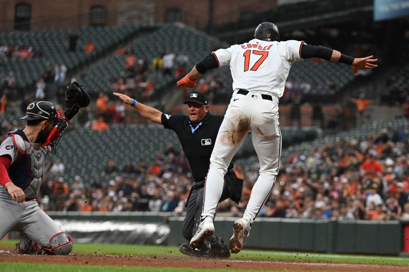 May 29, 2024; Baltimore, Maryland, USA; Baltimore Orioles outfielder Colton Cowser (17)   slides to score before Boston Red Sox manager Alex Cora (13) can apply a tag during the second inning  at Oriole Park at Camden Yards. Mandatory Credit: Tommy Gilligan-USA TODAY Sports