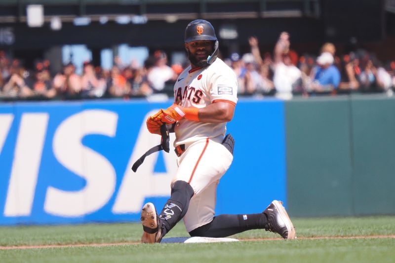 Jun 30, 2024; San Francisco, California, USA; San Francisco Giants center fielder Heliot Ramos (17) smiles after hitting a double against the Los Angeles Dodgers during the eighth inning at Oracle Park. Mandatory Credit: Kelley L Cox-USA TODAY Sports