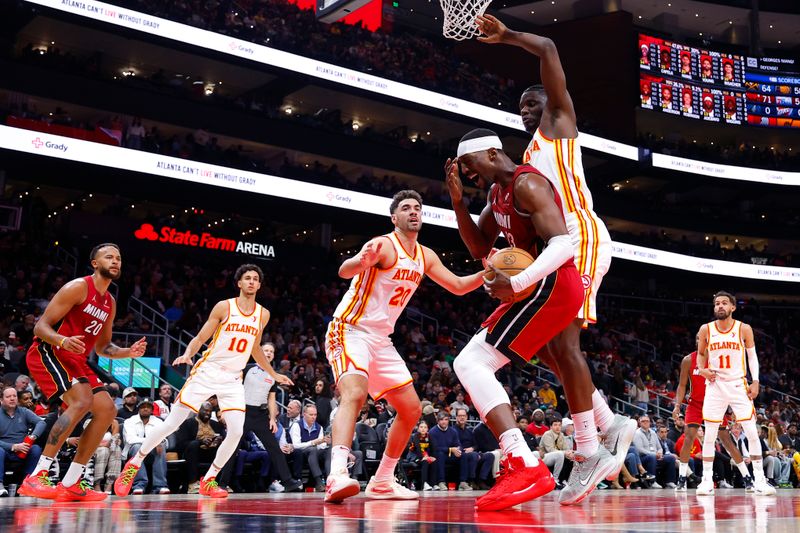 ATLANTA, GEORGIA - FEBRUARY 24: Bam Adebayo #13 of the Miami Heat reacts after being fouled during the first half against the Atlanta Hawks at State Farm Arena on February 24, 2025 in Atlanta, Georgia. NOTE TO USER: User expressly acknowledges and agrees that, by downloading and or using this photograph, User is consenting to the terms and conditions of the Getty Images License Agreement. (Photo by Todd Kirkland/Getty Images)