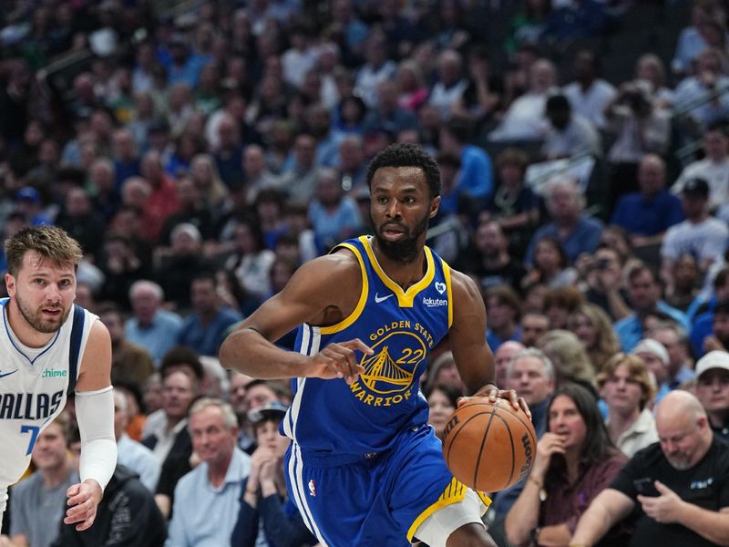 DALLAS, TX - MARCH 13: Andrew Wiggins #22 of the Golden State Warriors drives to the basket during the game against the Dallas Mavericks on March 13, 2024 at the American Airlines Center in Dallas, Texas. NOTE TO USER: User expressly acknowledges and agrees that, by downloading and or using this photograph, User is consenting to the terms and conditions of the Getty Images License Agreement. Mandatory Copyright Notice: Copyright 2024 NBAE (Photo by Glenn James/NBAE via Getty Images)