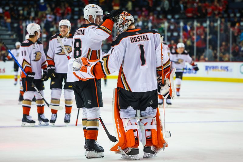 Apr 2, 2024; Calgary, Alberta, CAN; Anaheim Ducks goaltender Lukas Dostal (1) celebrate win with teammates after defeating the Calgary Flames during the third period at Scotiabank Saddledome. Mandatory Credit: Sergei Belski-USA TODAY Sports