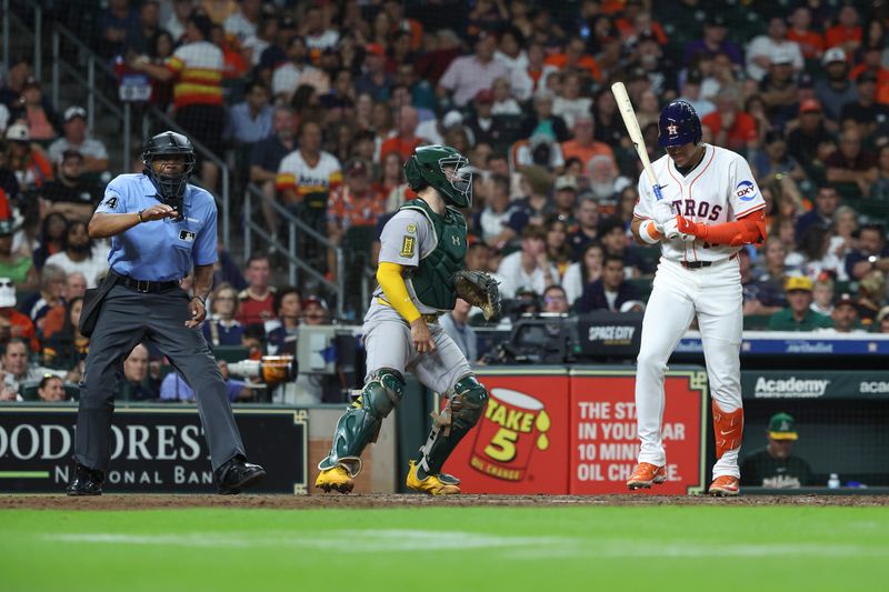 Jul 26, 2025; Houston, Texas, USA; Houston Astros right fielder Cam Smith (11) reacts after striking out during the seventh inning against the Athletics at Daikin Park. Mandatory Credit: Troy Taormina-Imagn Images