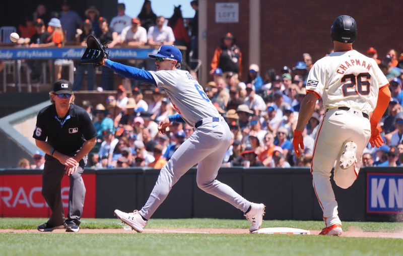 Jun 30, 2024; San Francisco, California, USA; Los Angeles Dodgers first baseman Cavan Biggio (6) catches the ball for an out against San Francisco Giants third baseman Matt Chapman (26) during the sixth inning at Oracle Park. Mandatory Credit: Kelley L Cox-USA TODAY Sports