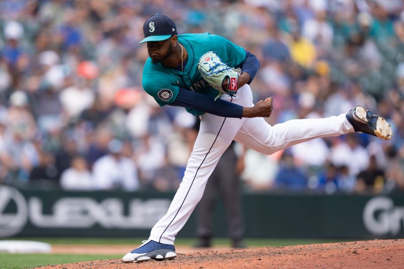 Jul 24, 2024; Seattle, Washington, USA;  Seattle Mariners reliever Gregory Santos (48) delivers a pitch during the eighth inning against the Los Angeles Angels at T-Mobile Park. Mandatory Credit: Stephen Brashear-USA TODAY Sports