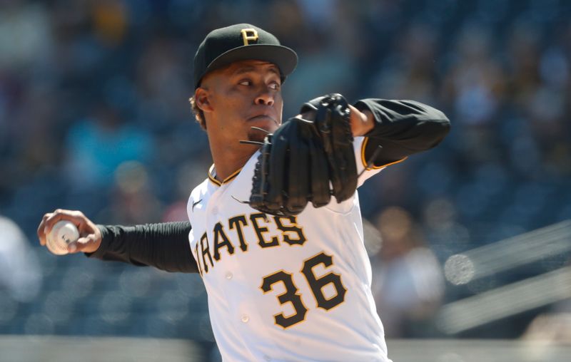 Apr 12, 2023; Pittsburgh, Pennsylvania, USA;  Pittsburgh Pirates relief pitcher Dauri Moreta (36) pitches against the Houston Astros during the seventh inning at PNC Park. Mandatory Credit: Charles LeClaire-USA TODAY Sports