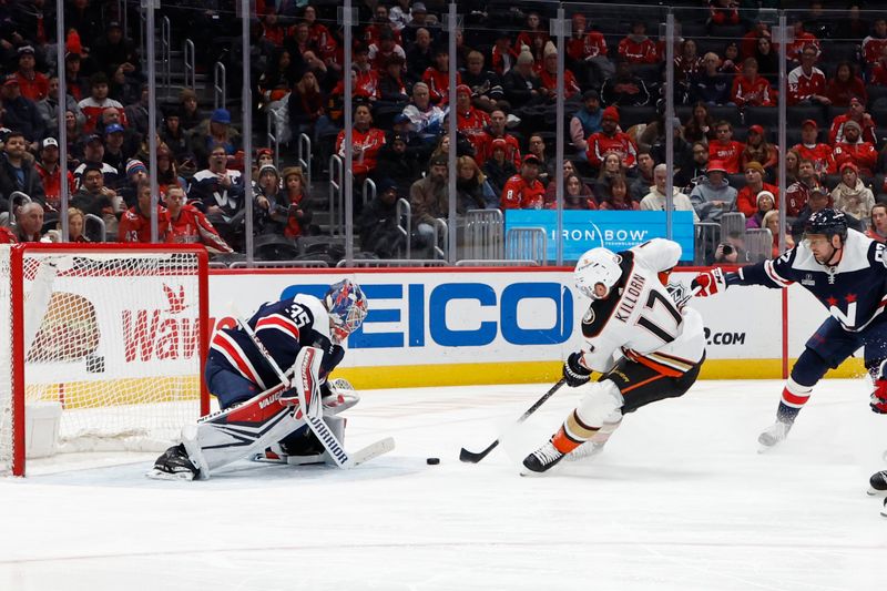 Jan 16, 2024; Washington, District of Columbia, USA; Anaheim Ducks left wing Alex Killorn (17) skates in on Washington Capitals goaltender Darcy Kuemper (35) as Capitals center Evgeny Kuznetsov (92) defends in the second period at Capital One Arena. Mandatory Credit: Geoff Burke-USA TODAY Sports