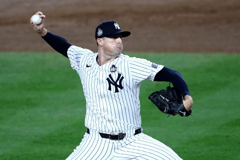 Oct 30, 2024; New York, New York, USA; New York Yankees pitcher Clay Holmes (35) throws during the seventh inning against the Los Angeles Dodgers in game five of the 2024 MLB World Series at Yankee Stadium. Mandatory Credit: Wendell Cruz-Imagn Images