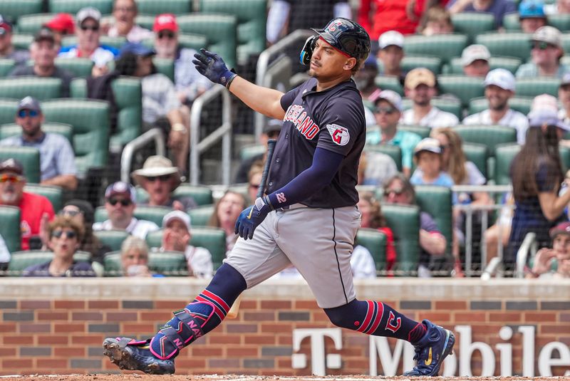 Apr 26, 2024; Cumberland, Georgia, USA; Cleveland Guardians first baseman Josh Naylor (22) loses his bat striking out against the Atlanta Braves during the third inning at Truist Park. Mandatory Credit: Dale Zanine-USA TODAY Sports