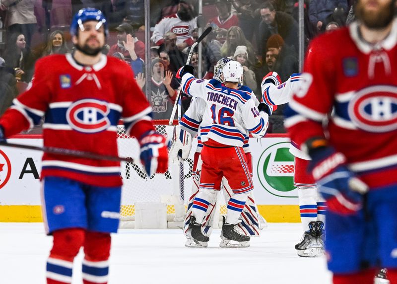 Mar 9, 2023; Montreal, Quebec, CAN; New York Rangers players gather to celebrate the win against the Montreal Canadiens after the end of the game at Bell Centre. Mandatory Credit: David Kirouac-USA TODAY Sports