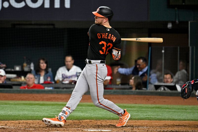 Oct 10, 2023; Arlington, Texas, USA; Baltimore Orioles first baseman Ryan O'Hearn (32) hits a single in the fourth inning against the Texas Rangers during game three of the ALDS for the 2023 MLB playoffs at Globe Life Field. Mandatory Credit: Jerome Miron-USA TODAY Sports