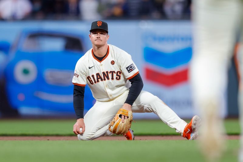 Jun 24, 2024; San Francisco, California, USA; San Francisco Giants third base Matt Chapman reacts after a play during the sixth inning against the Chicago Cubs at Oracle Park. All Giants players wore the number 24 in honor of Giants former player Willie Mays. Mandatory Credit: Sergio Estrada-USA TODAY Sports