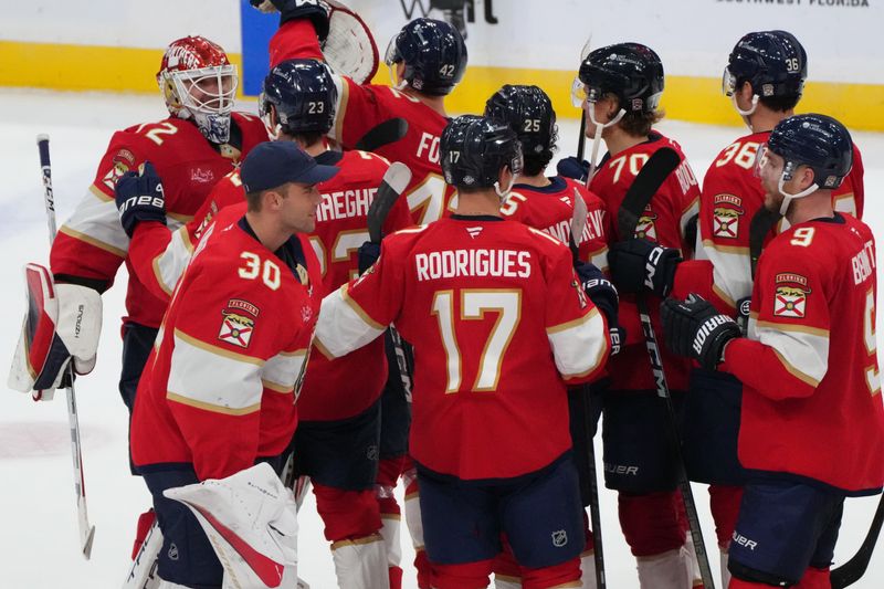 Oct 19, 2024; Sunrise, Florida, USA;  Florida Panthers goaltender Sergei Bobrovsky (72) is congratulated by teammates after an overtime victory against the Vegas Golden Knights at Amerant Bank Arena. Mandatory Credit: Jim Rassol-Imagn Images