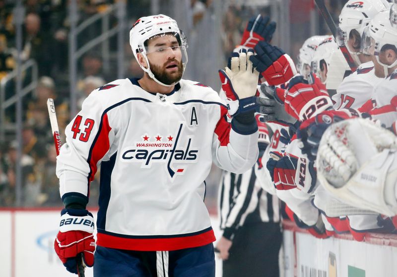 Jan 2, 2024; Pittsburgh, Pennsylvania, USA;  Washington Capitals right wing Tom Wilson (43) celebrates with the Capitals bench after scoring a goal against the Pittsburgh Penguins during the first period at PPG Paints Arena. Mandatory Credit: Charles LeClaire-USA TODAY Sports