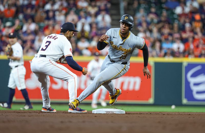 Jul 30, 2024; Houston, Texas, USA; Pittsburgh Pirates third baseman Ke'Bryan Hayes (13) rounds second base and runs to third base on a single by first baseman Connor Joe (not pictured) during the second inning against the Houston Astros at Minute Maid Park. Mandatory Credit: Troy Taormina-USA TODAY Sports