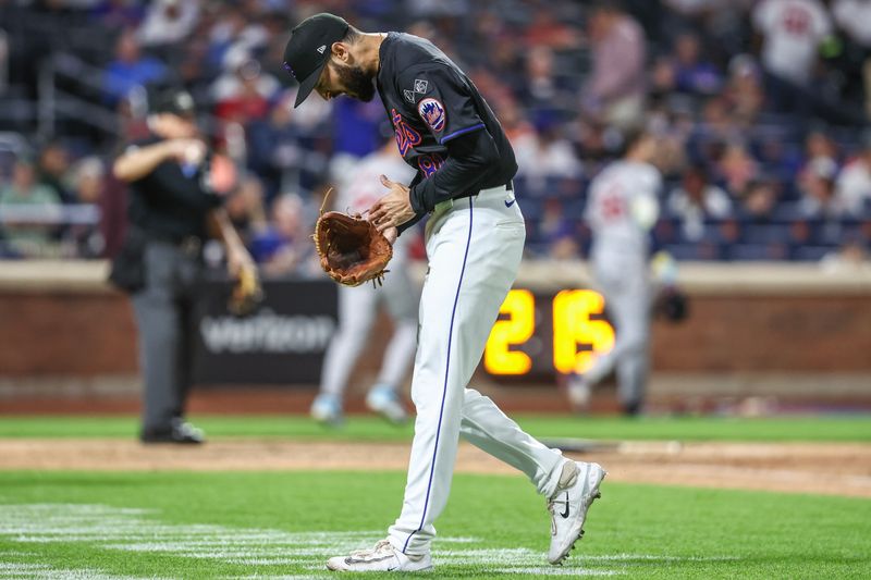 Sep 2, 2024; New York City, New York, USA;  New York Mets relief pitcher Danny Young (81) reacts after retiring the side in the eighth inning against the Boston Red Sox at Citi Field. Mandatory Credit: Wendell Cruz-USA TODAY Sports