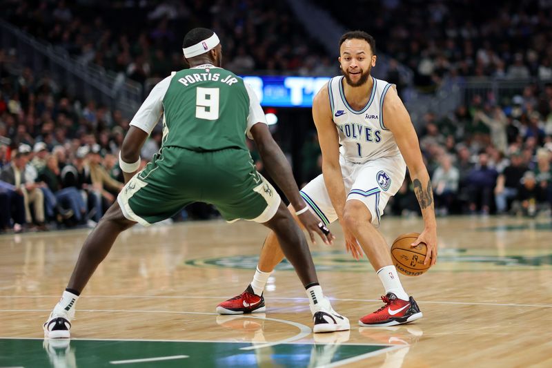 MILWAUKEE, WISCONSIN - FEBRUARY 08: Kyle Anderson #1 of the Minnesota Timberwolves is defended by Bobby Portis #9 of the Milwaukee Bucks during a game at Fiserv Forum on February 08, 2024 in Milwaukee, Wisconsin. NOTE TO USER: User expressly acknowledges and agrees that, by downloading and or using this photograph, User is consenting to the terms and conditions of the Getty Images License Agreement. (Photo by Stacy Revere/Getty Images)