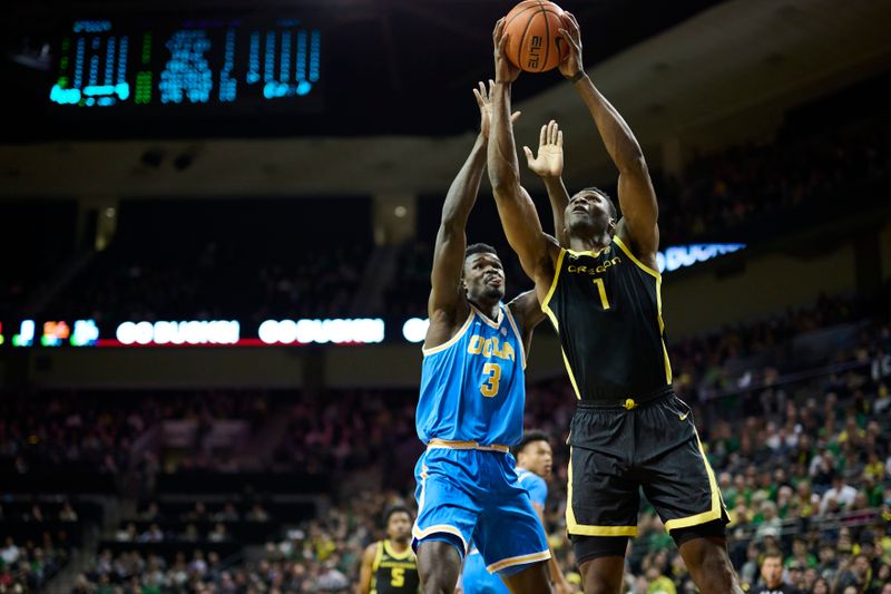 Feb 11, 2023; Eugene, Oregon, USA; Oregon Ducks center N'Faly Dante (1) scores a basket during the first half against UCLA Bruins forward Adem Bona (3) at Matthew Knight Arena. Mandatory Credit: Troy Wayrynen-USA TODAY Sports