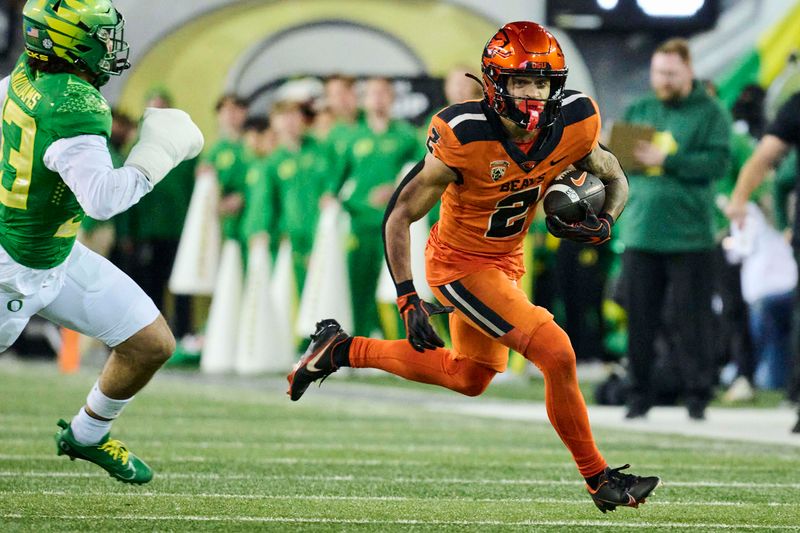 Nov 24, 2023; Eugene, Oregon, USA; Oregon State Beavers wide receiver Anthony Gould (2) catches a pass during the second half against Oregon Ducks defensive back Evan Williams (33) at Autzen Stadium. Mandatory Credit: Troy Wayrynen-USA TODAY Sports