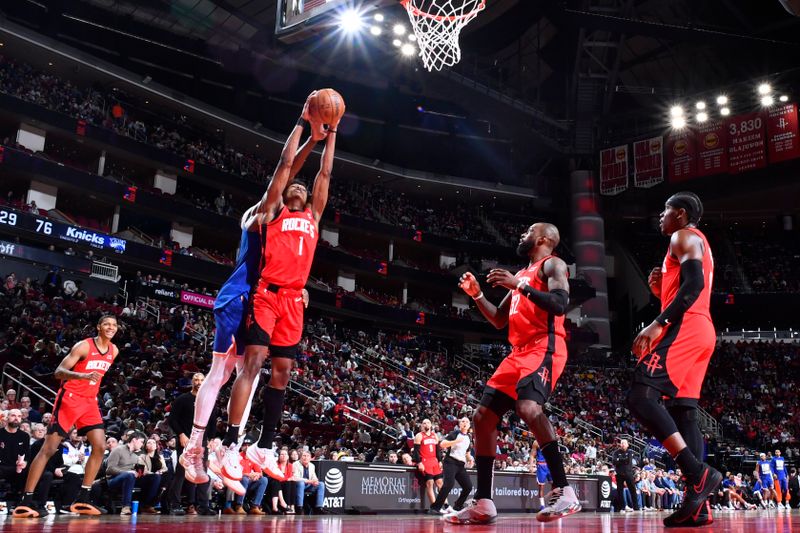 HOUSTON, TX - FEBRUARY 12: Amen Thompson #1 of the Houston Rockets rebounds the ball during the game against the New York Knicks on February 12, 2024 at the Toyota Center in Houston, Texas. NOTE TO USER: User expressly acknowledges and agrees that, by downloading and or using this photograph, User is consenting to the terms and conditions of the Getty Images License Agreement. Mandatory Copyright Notice: Copyright 2024 NBAE (Photo by Logan Riely/NBAE via Getty Images)