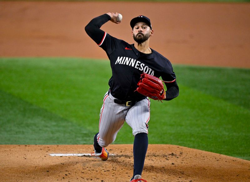 Aug 18, 2024; Arlington, Texas, USA; Minnesota Twins starting pitcher Pablo Lopez (49) pitches against the Texas Rangers during the first inning at Globe Life Field. Mandatory Credit: Jerome Miron-USA TODAY Sports