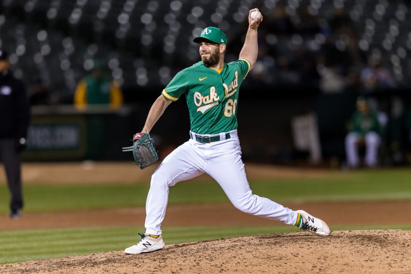 Apr 18, 2023; Oakland, California, USA; Oakland Athletics relief pitcher Sam Moll (60) throws against the Chicago Cubs during the sixth inning at RingCentral Coliseum. Mandatory Credit: John Hefti-USA TODAY Sports