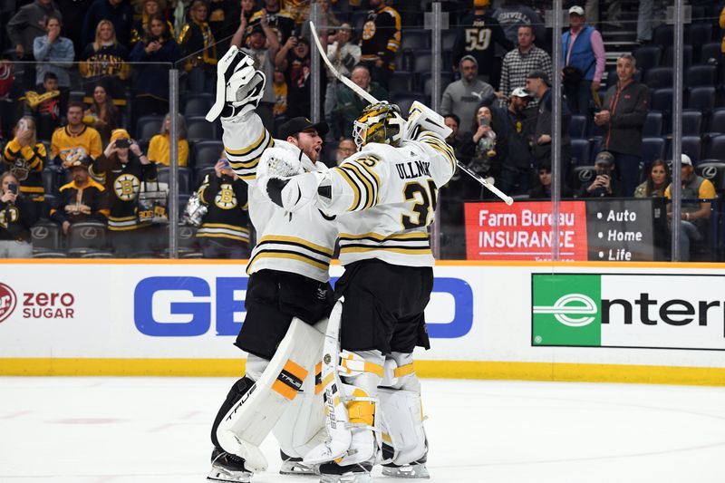 Apr 2, 2024; Nashville, Tennessee, USA; Boston Bruins goaltender Linus Ullmark (35) celebrates with goaltender Jeremy Swayman (1) after a win against the Nashville Predators at Bridgestone Arena. Mandatory Credit: Christopher Hanewinckel-USA TODAY Sports