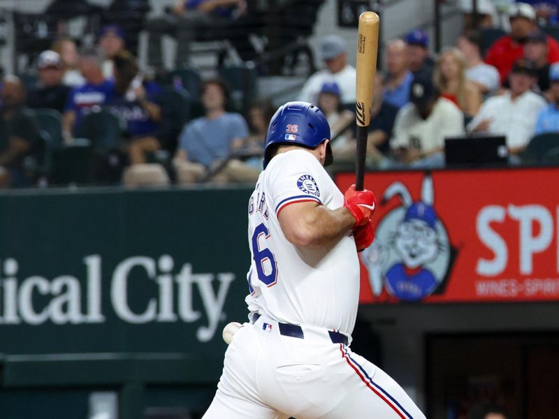 Sep 18, 2024; Arlington, Texas, USA;  Texas Rangers left fielder Wyatt Langford (36) gets hit by a pitch during the third inning against the Toronto Blue Jays at Globe Life Field. Mandatory Credit: Kevin Jairaj-Imagn Images