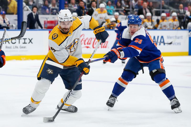 Apr 6, 2024; Elmont, New York, USA; Nashville Predators left wing Filip Forsberg (9) skates with the puck against New York Islanders center Casey Cizikas (53) during the first period at UBS Arena. Mandatory Credit: Tom Horak-USA TODAY Sports