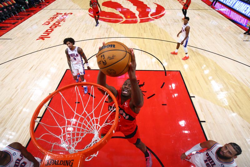 TORONTO, CANADA - OCTOBER 25: Jonathan Mogbo #2 of the Toronto Raptors dunks the ball during the game against the Philadelphia 76ers on October 25, 2024 at the Scotiabank Arena in Toronto, Ontario, Canada.  NOTE TO USER: User expressly acknowledges and agrees that, by downloading and or using this Photograph, user is consenting to the terms and conditions of the Getty Images License Agreement.  Mandatory Copyright Notice: Copyright 2024 NBAE (Photo by Vaughn Ridley/NBAE via Getty Images)