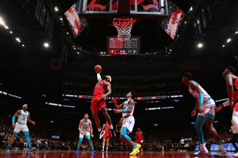 TORONTO, CANADA - MARCH 3: Gary Trent Jr. #33 of the Toronto Raptors drives to the basket during the game against the Charlotte Hornets on March 3, 2024 at the Scotiabank Arena in Toronto, Ontario, Canada.  NOTE TO USER: User expressly acknowledges and agrees that, by downloading and or using this Photograph, user is consenting to the terms and conditions of the Getty Images License Agreement.  Mandatory Copyright Notice: Copyright 2024 NBAE (Photo by Vaughn Ridley/NBAE via Getty Images)