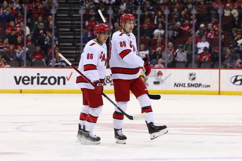 Mar 9, 2024; Newark, New Jersey, USA; Carolina Hurricanes center Martin Necas (88) celebrates his goal against the New Jersey Devils during the first period at Prudential Center. Mandatory Credit: Ed Mulholland-USA TODAY Sports