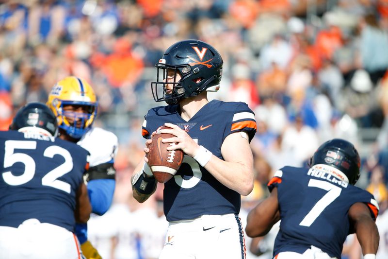 Nov 12, 2022; Charlottesville, Virginia, USA; Virginia Cavaliers quarterback Brennan Armstrong (5) prepares to throw the ball against the Pittsburgh Panthers during the first half at Scott Stadium. Mandatory Credit: Amber Searls-USA TODAY Sports