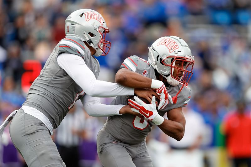 Nov 18, 2023; Colorado Springs, Colorado, USA; UNLV Rebels quarterback Jayden Maiava (1) looks to hand the ball off to running back Vincent Davis Jr. (5) in the first quarter against the Air Force Falcons at Falcon Stadium. Mandatory Credit: Isaiah J. Downing-USA TODAY Sports