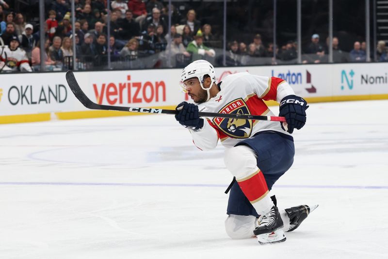 Dec 10, 2025; Salt Lake City, Utah, USA; Florida Panthers defenseman Seth Jones (3) holds the follow through on a shot against the Utah Mammoth during the first period at Delta Center. Mandatory Credit: Rob Gray-Imagn Images