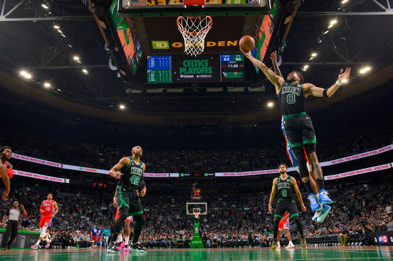 BOSTON, MA - MAY 1: Jayson Tatum #0 of the Boston Celtics rebounds the ball during the game against the Philadelphia 76ers during Round 2 Game 1 of the 2023 NBA Playoffs on May 1, 2023 at the TD Garden in Boston, Massachusetts. NOTE TO USER: User expressly acknowledges and agrees that, by downloading and or using this photograph, User is consenting to the terms and conditions of the Getty Images License Agreement. Mandatory Copyright Notice: Copyright 2023 NBAE  (Photo by Jesse D. Garrabrant/NBAE via Getty Images)