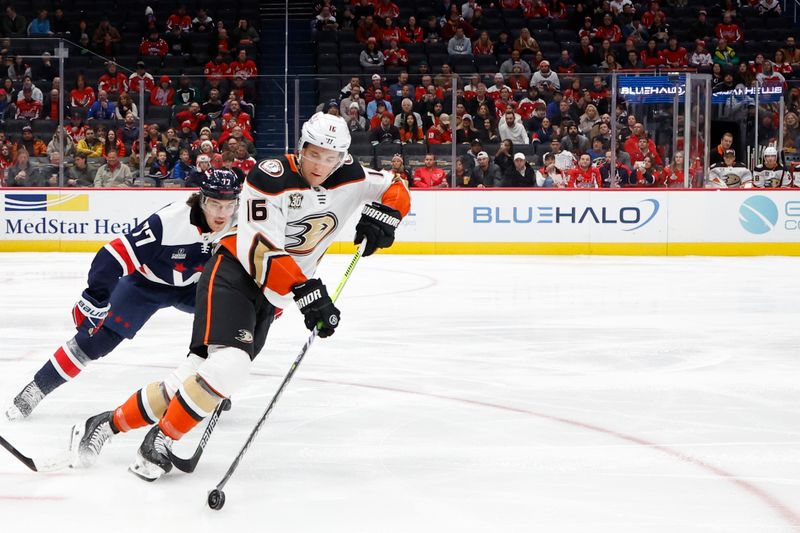 Jan 16, 2024; Washington, District of Columbia, USA; Anaheim Ducks center Ryan Strome (16) skates with the puck as Washington Capitals right wing T.J. Oshie (77) chases in the first period at Capital One Arena. Mandatory Credit: Geoff Burke-USA TODAY Sports