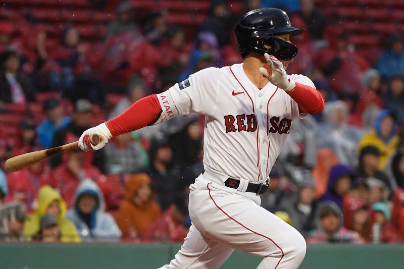 Sep 23, 2023; Boston, Massachusetts, USA;  Boston Red Sox left fielder Masataka Yoshida (7) hits a single against the Chicago White Sox during the seventh inning at Fenway Park. Mandatory Credit: Bob DeChiara-USA TODAY Sports