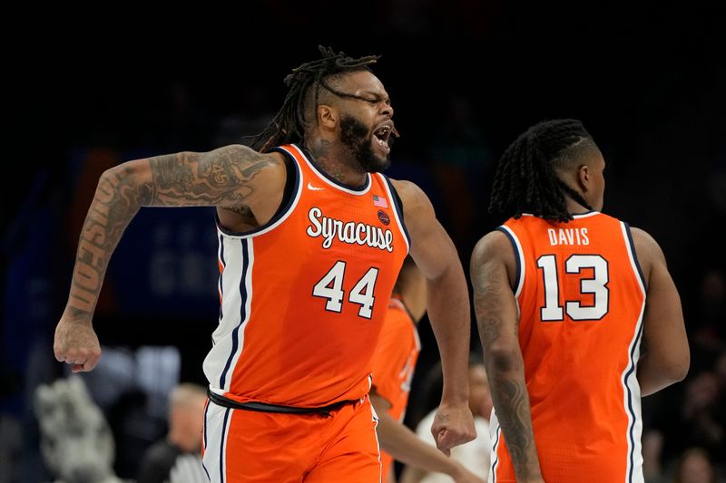 Mar 11, 2025; Charlotte, NC, USA; Syracuse Orange center Eddie Lampkin Jr. (44) reacts in the first half at Spectrum Center. Mandatory Credit: Bob Donnan-Imagn Images