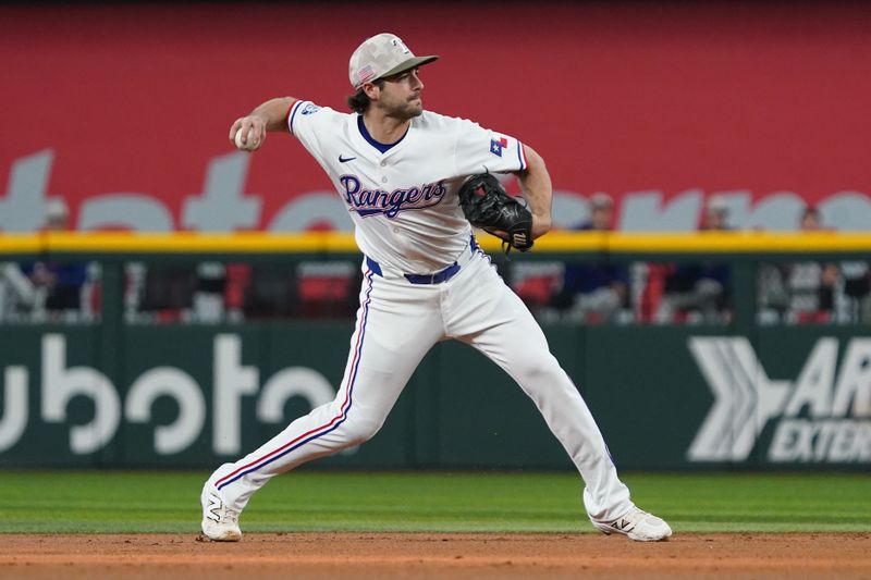 May 17, 2025; Arlington, Texas, USA; Texas Rangers shortstop Josh Smith (8) throws to first base during the second inning against the Houston Astros at Globe Life Field. Mandatory Credit: Raymond Carlin III-Imagn Images
