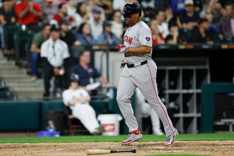 Jun 6, 2024; Chicago, Illinois, USA; Boston Red Sox third baseman Rafael Devers (11) scores against the Chicago White Sox during the sixth inning at Guaranteed Rate Field. Mandatory Credit: Kamil Krzaczynski-USA TODAY Sports