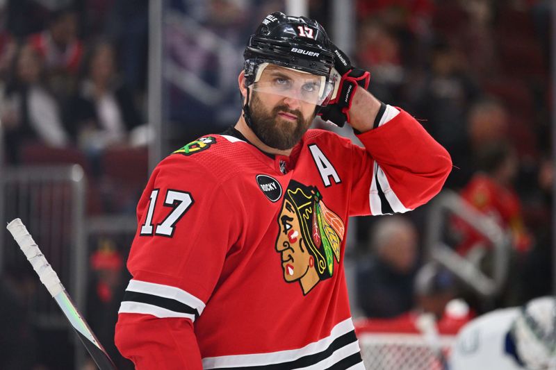 Feb 13, 2024; Chicago, Illinois, USA;  Chicago Blackhawks forward Nick Foligno (17) gets ready to take a face off on the power play in the first period against the Vancouver Canucks at United Center. Mandatory Credit: Jamie Sabau-USA TODAY Sports