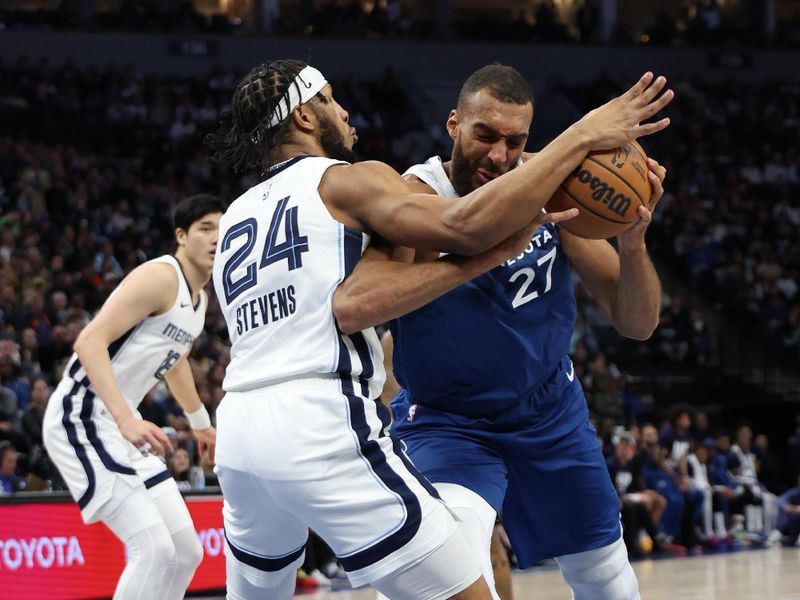 MINNEAPOLIS, MN -  FEBRUARY 28:  Rudy Gobert #27 of the Minnesota Timberwolves drives to the basket during the game as Lamar Stevens #24 of the Memphis Grizzlies plays defense on February 28, 2024 at Target Center in Minneapolis, Minnesota. NOTE TO USER: User expressly acknowledges and agrees that, by downloading and or using this Photograph, user is consenting to the terms and conditions of the Getty Images License Agreement. Mandatory Copyright Notice: Copyright 2024 NBAE (Photo by Jordan Johnson/NBAE via Getty Images)