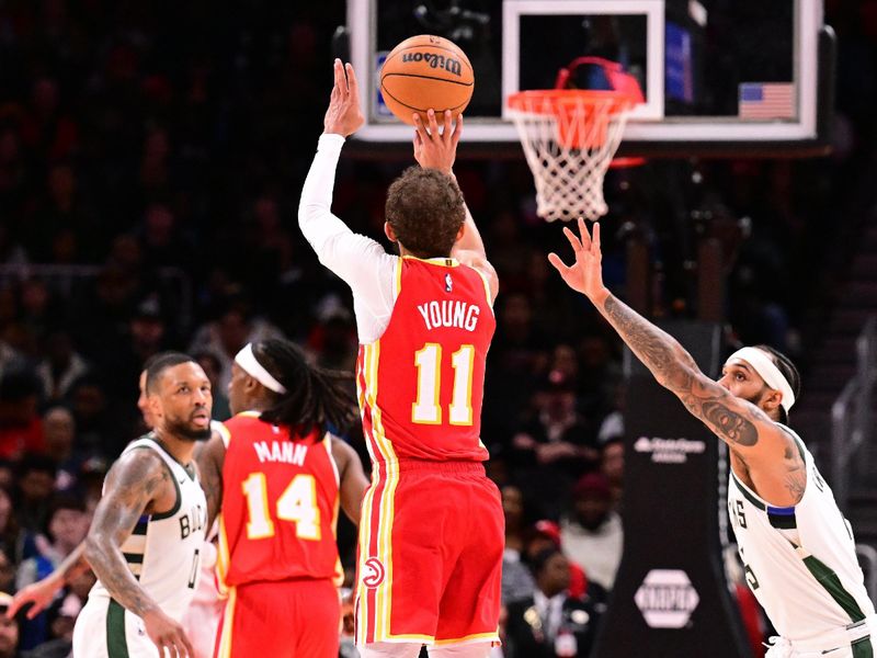 ATLANTA, GA - MARCH 4: Trae Young #11 of the Atlanta Hawks three point basket during the game against the Milwaukee Bucks on March 4, 2025 at State Farm Arena in Atlanta, Georgia. NOTE TO USER: User expressly acknowledges and agrees that, by downloading and/or using this Photograph, user is consenting to the terms and conditions of the Getty Images License Agreement. Mandatory Copyright Notice: Copyright 2025 NBAE(Photo by Adam Hagy/NBAE via Getty Images)