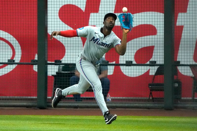 May 26, 2024; Phoenix, Arizona, USA; Miami Marlins outfielder Dane Myers (54) makes the running catch for an out against the Arizona Diamondbacks in the seventh inning at Chase Field. Mandatory Credit: Rick Scuteri-USA TODAY Sports