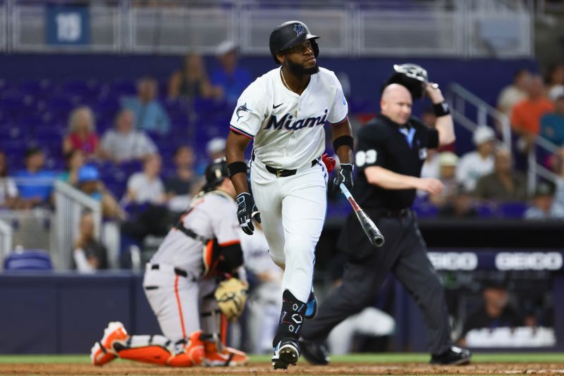 Apr 17, 2024; Miami, Florida, USA; Miami Marlins designated hitter Bryan De La Cruz (14) looks on after hitting a home run against the San Francisco Giants during the sixth inning at loanDepot Park. Mandatory Credit: Sam Navarro-USA TODAY Sports