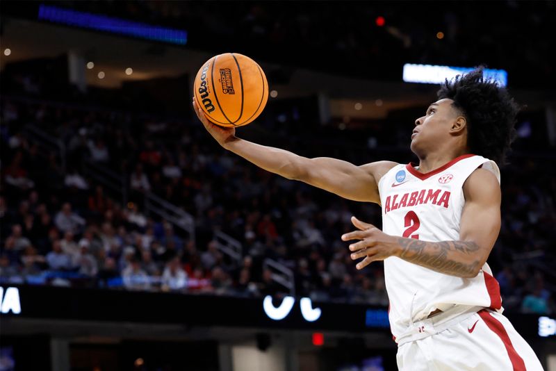 Mar 21, 2025; Cleveland, OH, USA; Alabama Crimson Tide guard Aden Holloway (2) shoots the ball in the second half during the NCAA Tournament First Round at Rocket Arena. Mandatory Credit: Rick Osentoski-Imagn Images