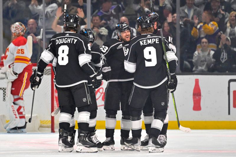 Apr 11, 2024; Los Angeles, California, USA;  Los Angeles Kings celebrate after a goal by left wing Kevin Fiala (22) in the first period against the Calgary Flames at Crypto.com Arena. Mandatory Credit: Jayne Kamin-Oncea-USA TODAY Sports